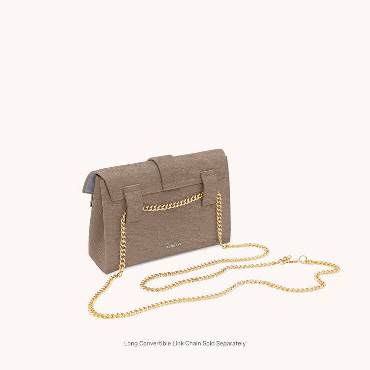 aria belt bag mimosa latte with gold hardware with chain back at an angle view