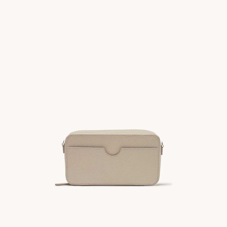 convertible jewelry box bag in pebbled sand back view with pocket