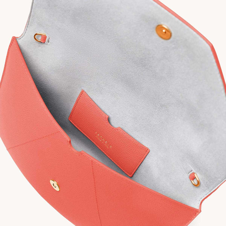 Mini envelope sleeve in coral interior view.