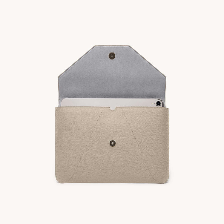 Mini envelope sleeve in sand front view with flap open.