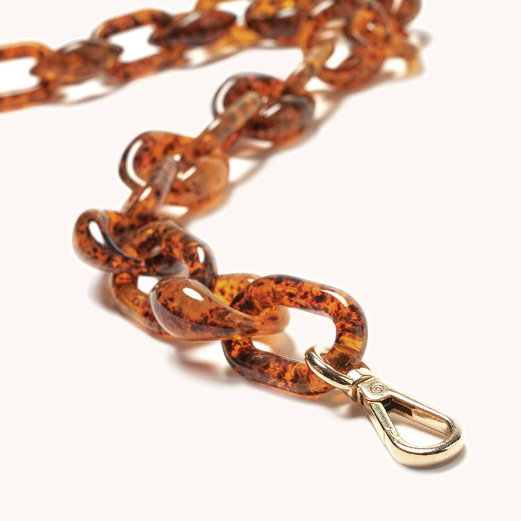 infinity acetate chain shoulder in tortoise closeup of hardware