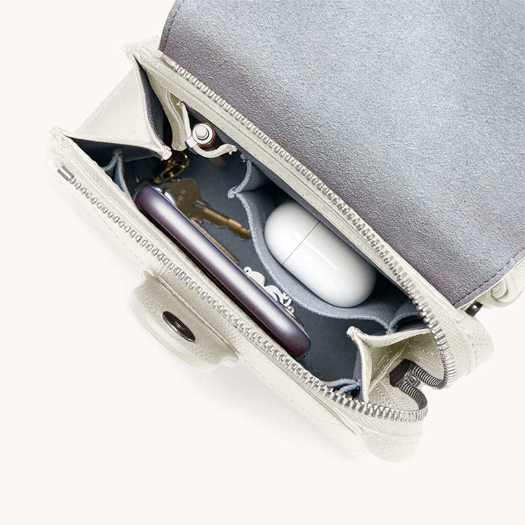 Mini Alunna Bag Pebbled Cream with Silver Hardware Interior View with What Fits: phone, AirPods, keys