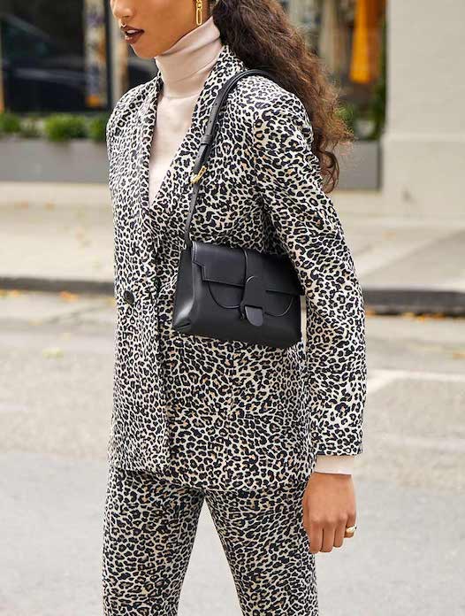 aria belt bag cactus midnight on model shoulder bag