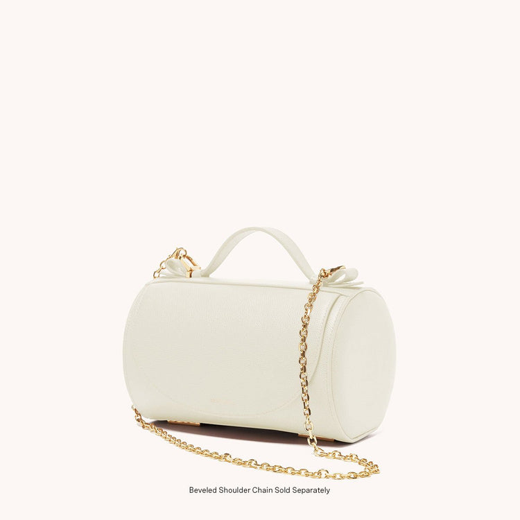 barrel bag pebbled cream side view with gold chain