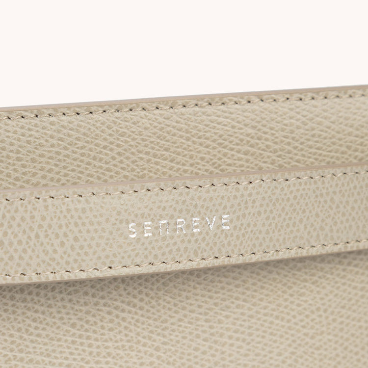 bracelet pouch pebbled sand close up