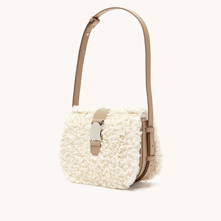 cadence crossbody faux shearling sand side view
