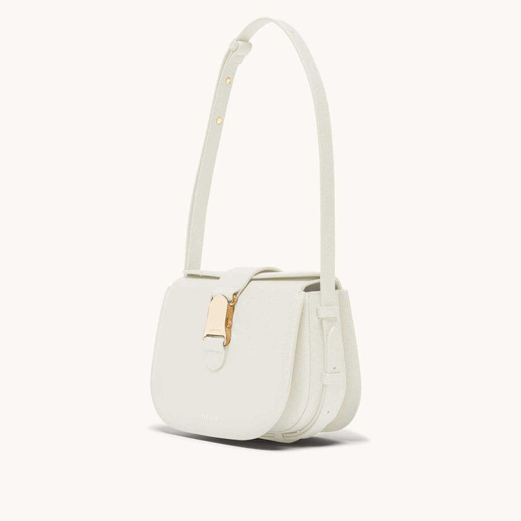 cadence crossbody pebbled cream side view