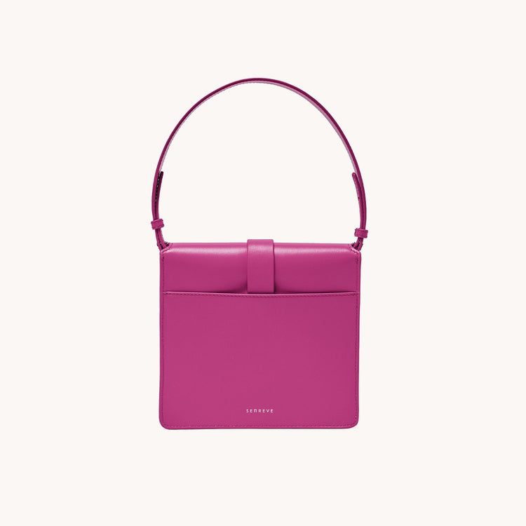 barbiecore pink leather handbag with handle back view