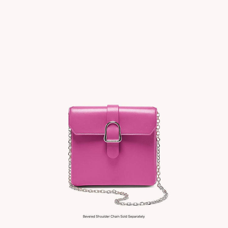 square saddle bag in barbiecore pink leather front view with shoulder link chain strap