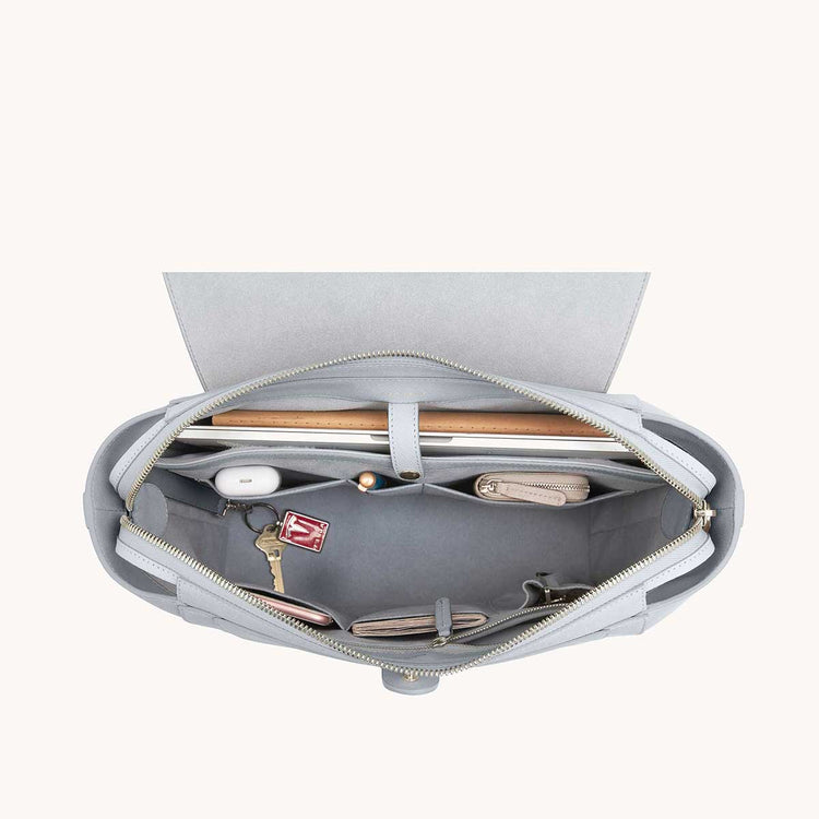 Maestra Bag Pebbled Ice with Silver Hardware Interior View with What Fits: laptop, cards, phone, keys, etc.