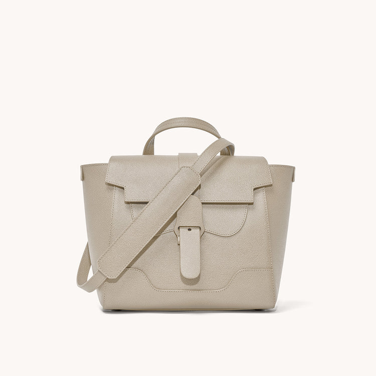 Midi Maestra Bag Pebbled Sand with Silver Hardware Front View with long strap draped over top