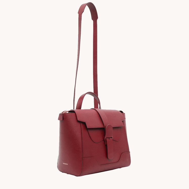 Midi Maestra Bag Pebbled Merlot with Gold Hardware Angled View with Long Strap