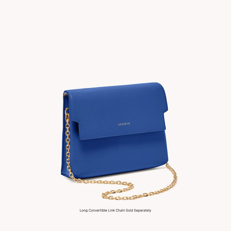 Mini cavalla satchel in azure angled view with gold chain.