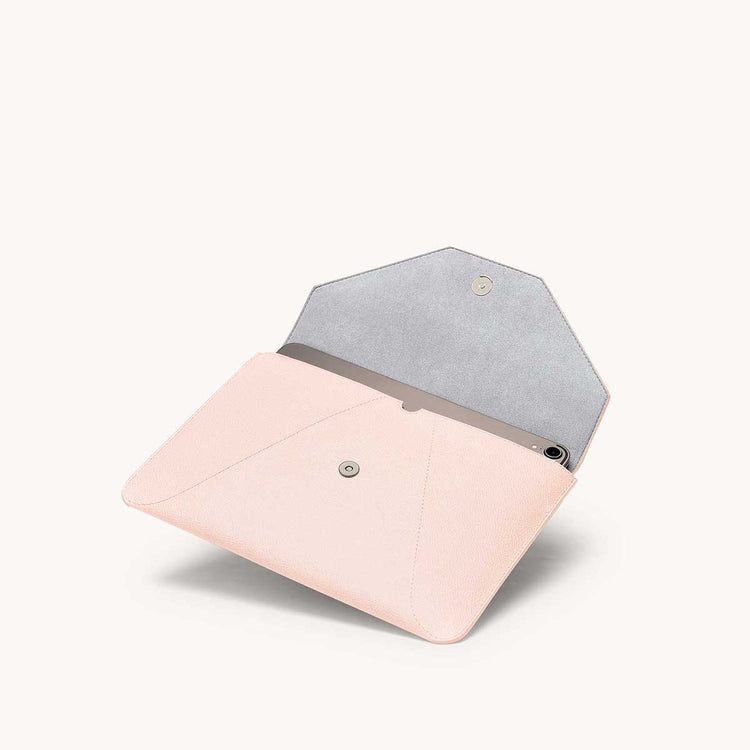 Mini envelope sleeve in blush angled view with flap open.