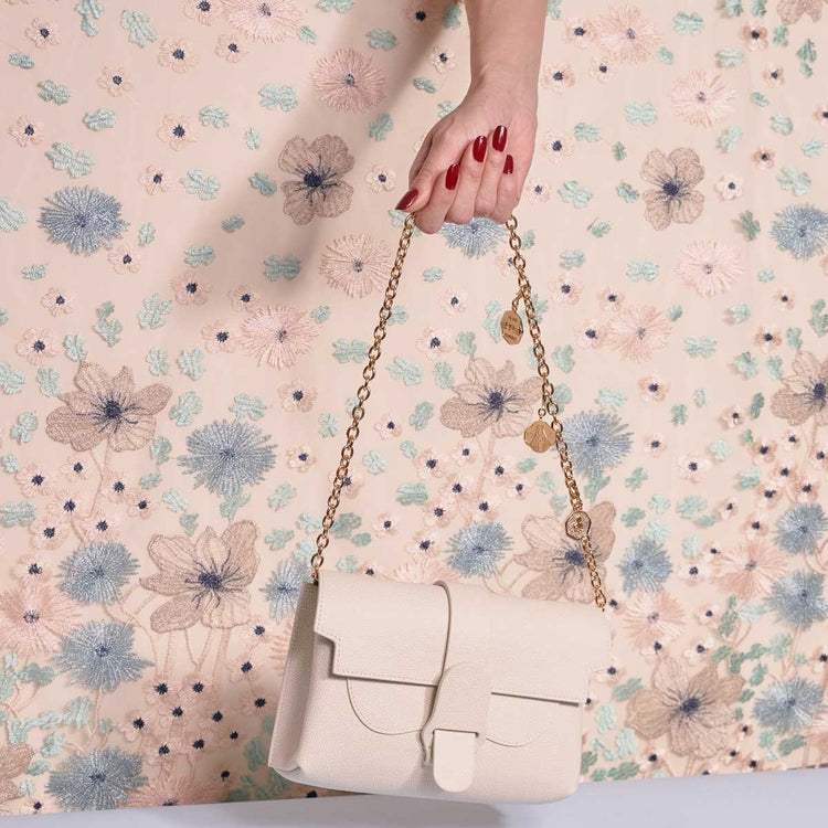 Three Ponte Vecchio Pendant Gold Attached to Gold Bag Strap on Aria Belt Bag Pebbled Cream