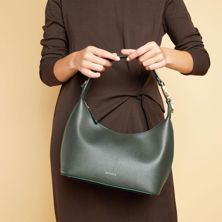 Woman with Tan Skin wearing Strati Sporta Pebbled Merlot with Gold Hardware in Hands