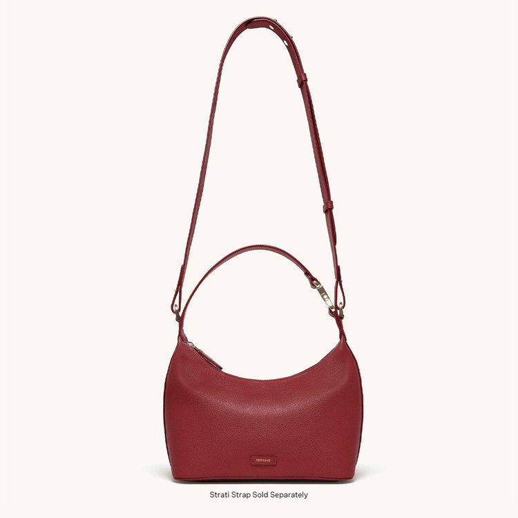 Strati Sporta Pebbled Merlot with Gold Hardware Strati Strap Attached
