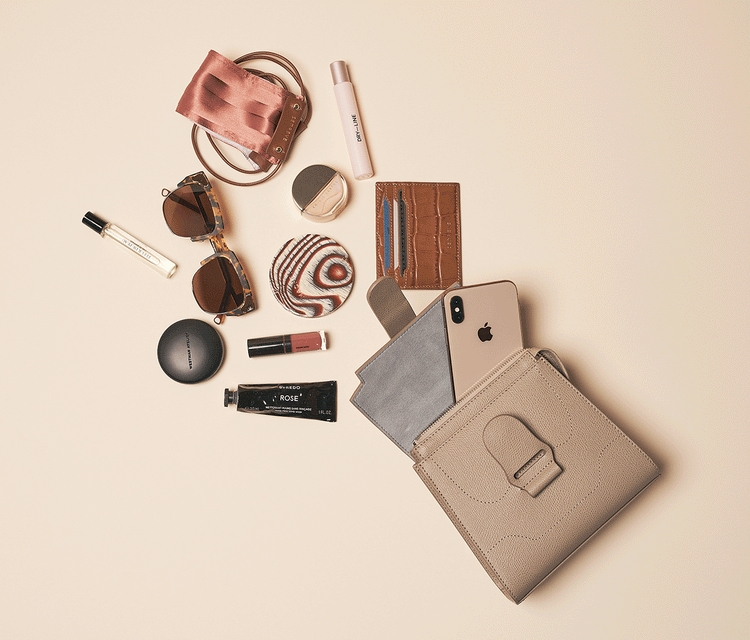 Gif of Mini Alunna Bag Dolce Butterscotch with Gold Hardware showing what can fit inside: phone, sunglasses, mask, card case, lip gloss